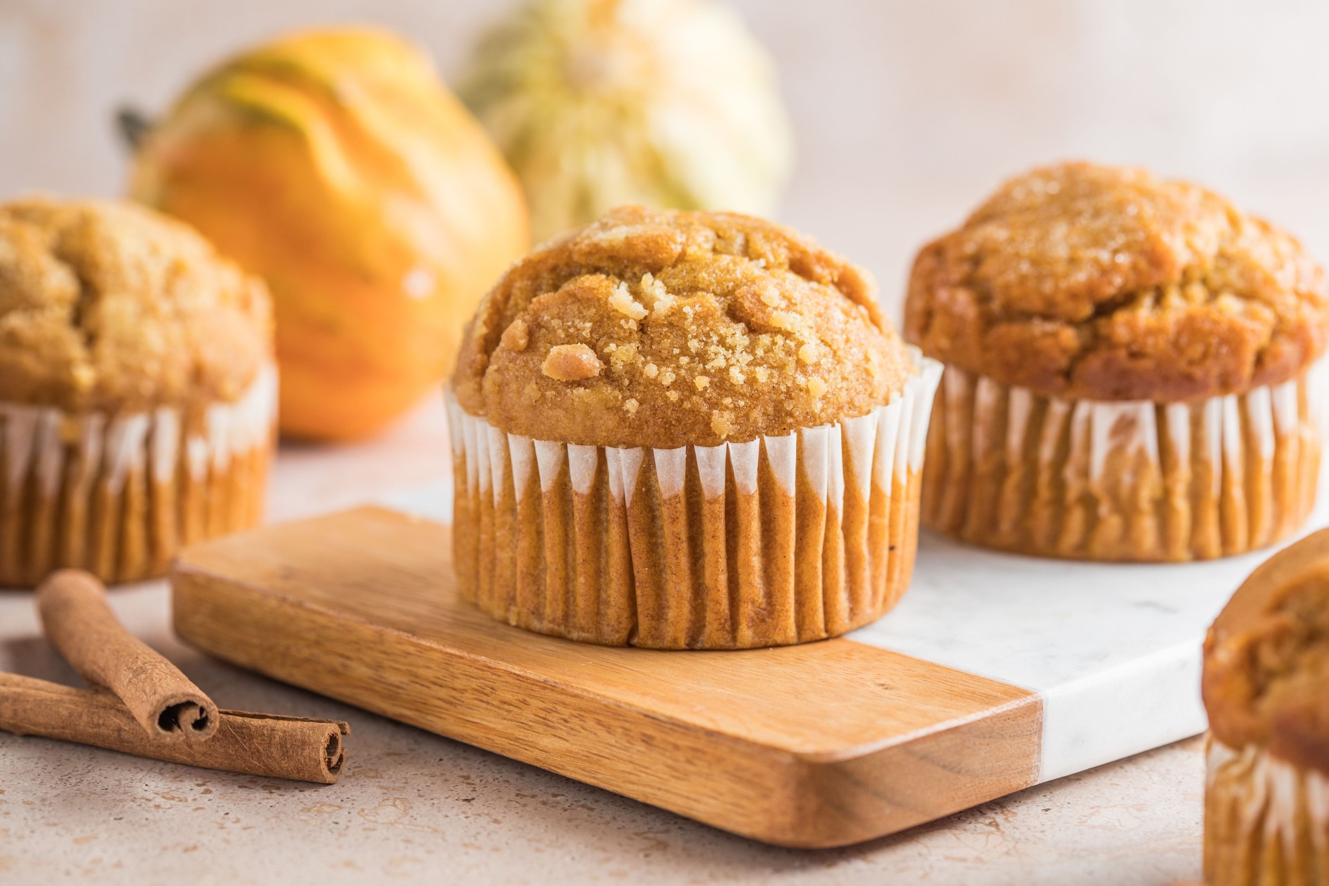 Autumn pumpkin cupcakes or  baked muffins with fresh pumpkin for Thanksgiving day.
